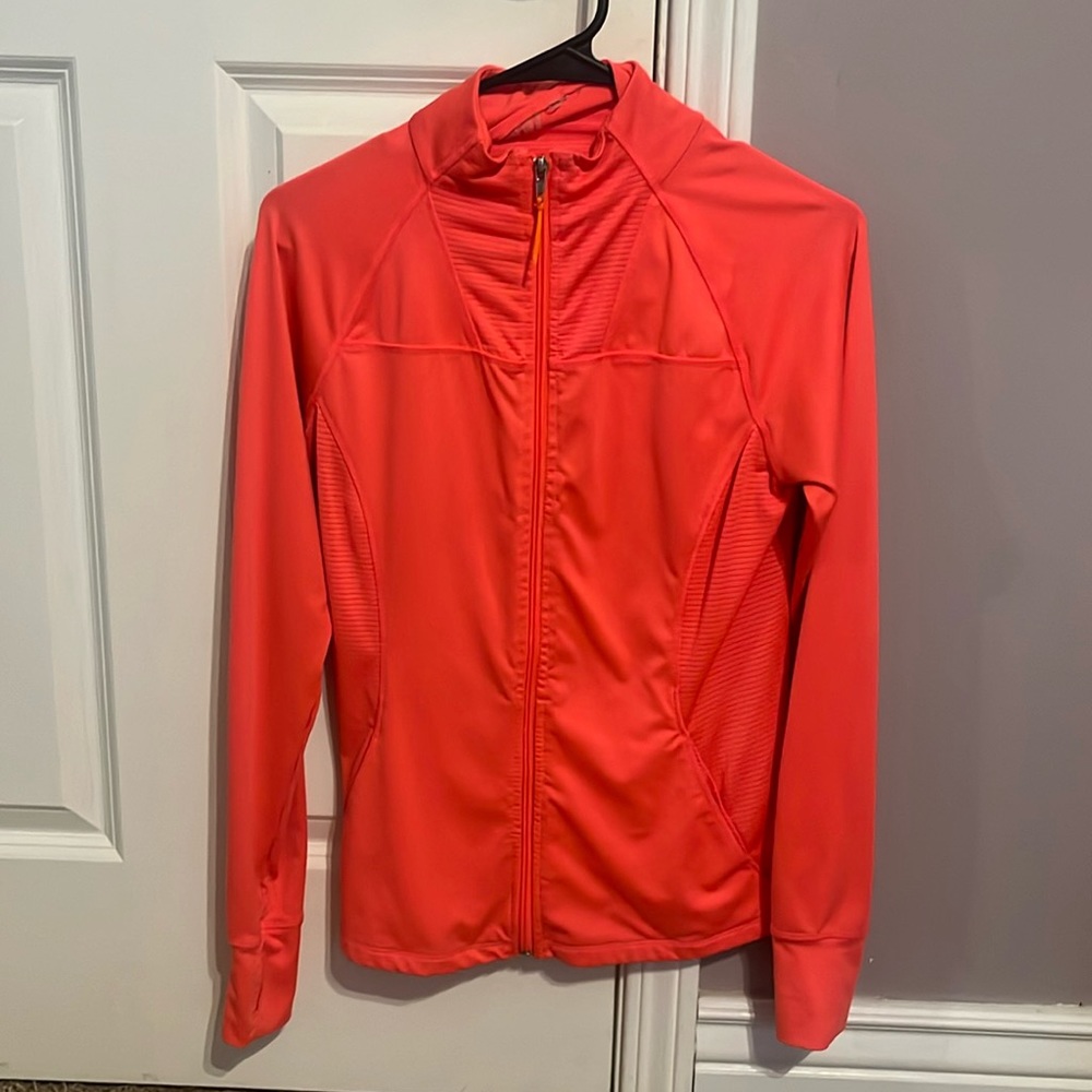 A fitted hot pink zip up